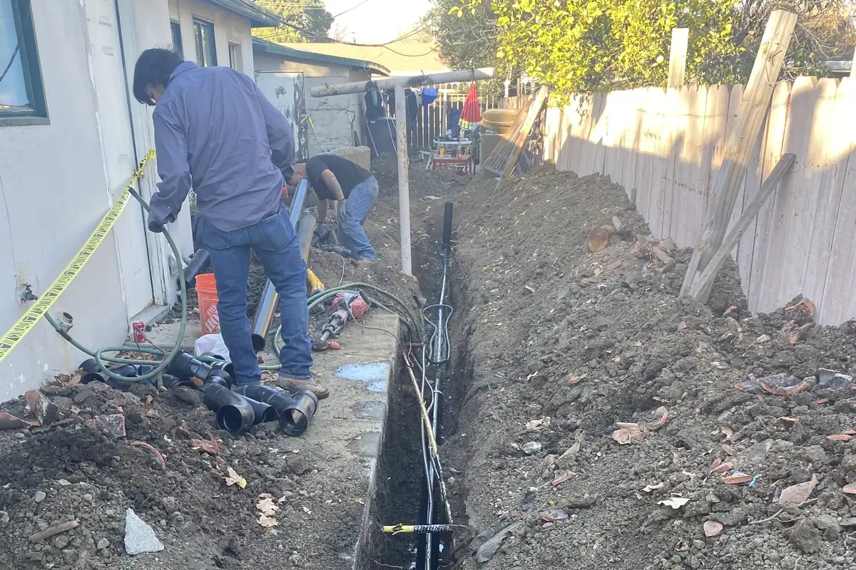Trenching alongside a Solano County home to replace a failed main sewer line.
